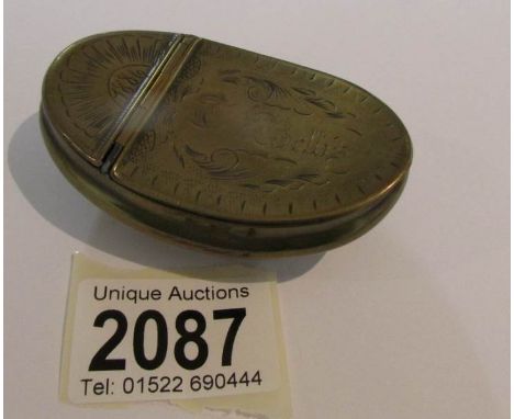 A 19th century brass snuff box dated 1886.