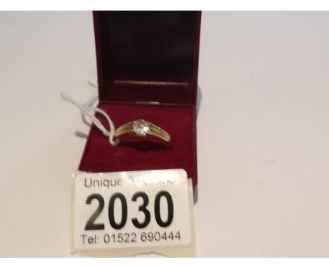 An 18ct gold ring set with solitaire diamond and with 9ct gold spacer bar, ring hall marked 18ct, approximately 5 grams, size