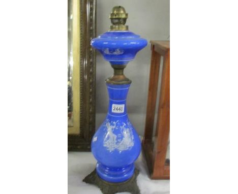 A blue glass and metal oil lamp base with Grecian scene.