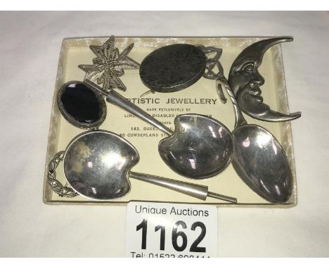 6 silver brooches a silver caddy spoon &amp; 2 other silver spoons
