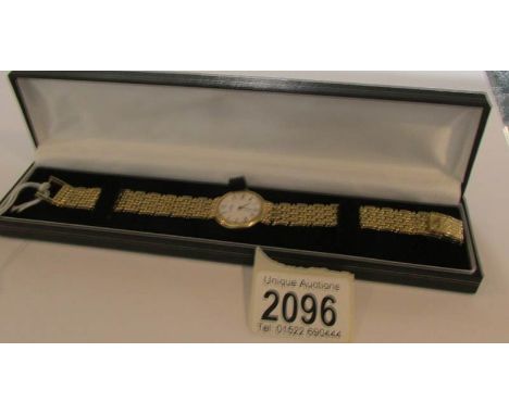 A Baume &amp; Mercier 18ct gold ladies bracelet watch - rear of watch inscribed '14-2-89' and marked '16601 9 1613308'.