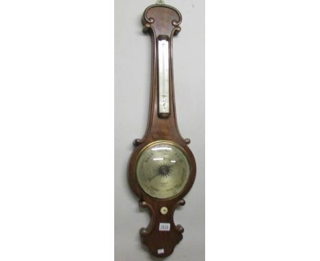 An oak barometer with mercury thermometer by E. Brunner, Myton Gate, Hull.