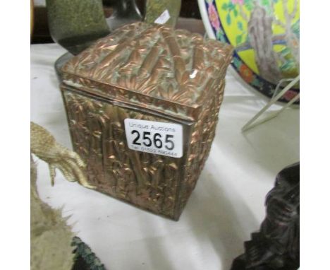 A Chinese metal tea caddy in bamboo design.