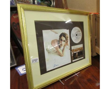 A framed and glazed Celine Dion display.