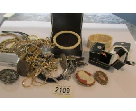 A mixed lot of costume jewellery including bone bangle, Gallipoli campaign ring inscribed 'Suvla Bay 3.10.15', bracelets, nec