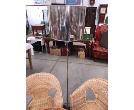 A chrome standard lamp