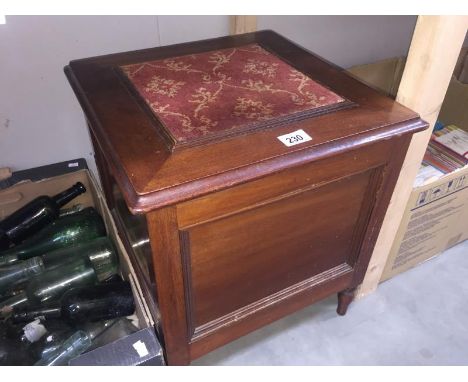 A Victorian mahogany commode with carpet panel top