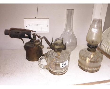 2 hand oil lamps and a blow lamp