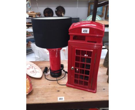 A red telephone box phone and a post box table lamp