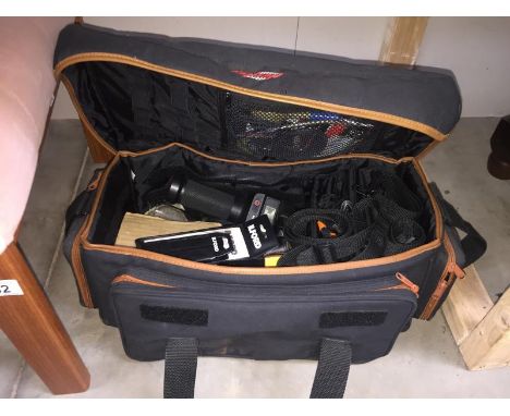 A camera holdall and contents including Hanimex T236 flash and other accessories