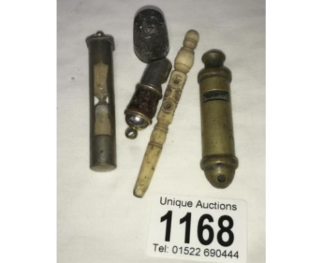 A brass scout whistle, a leather &amp; metal whistle, a travel egg timer, silver thimble &amp; a Stanhope