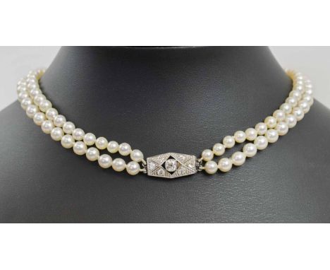 ART DECO TWO ROW GRADUATED CULTURED PEARL NECKLACE WITH DIAMOND CLASP.