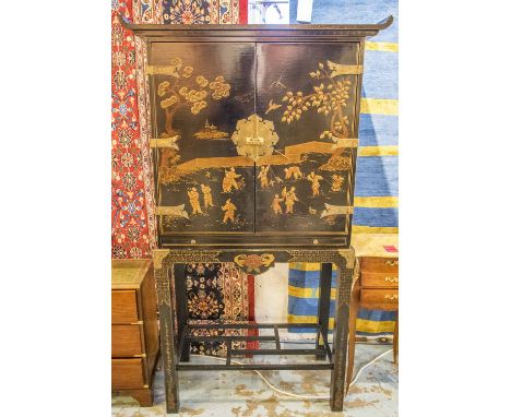 COCKTAIL CABINET, early 20th century Chinese black lacquer and Chinoiserie gilt decorated with two doors enclosing a shelf an