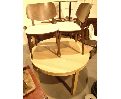 Circular beech effect dining table with extension panel and three chairs