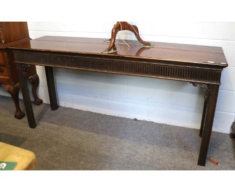A Large Mahogany Console Table, in George III Style, early 20th century, with two concealed drawers to the nulled frieze, hav