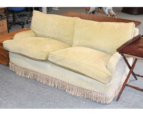 A Modern Two Seater Feather Filled Sofa, with four squab cushions, 180cm by 100cm by 80cmUpholstery faded but not stained and