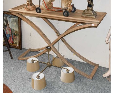 An Oka "Avignon" Oak Console Table, with dished top and on x-form base, 130cm by 140cm by 83cm, together with a modern four b