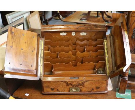 A Victorian Figured Walnut Stationary Cabinet, fitted and housing a perpetual calender, 41cm by 27cm by 36cmSome month and da