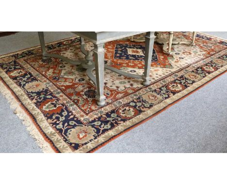 Anatolian Carpet, the ivory field of stylised plants centred by a terracotta indigo and ivory diamond medallion framed by spa