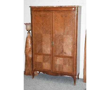 A French Marble Top Inlaid Kingwood Cupboard, with gilt metal mounts, one adjustable shelf and on scroll supports, 110cm by 4