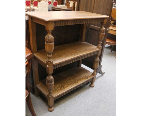 A Reproduction Oak Three Tier Buffet, nulled carving and on bulbous supports, 96cm by 45cm by 114cm