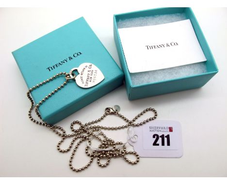 Tiffany &amp; Co; A Hallmarked Silver Pendant on Chain, "Please Return To Tiffany &amp; Co New York" numbered "M66130", on a 