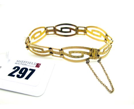 A Vintage Openwork Bracelet, of geometric design with engraved decoration, stamped "9ct" (8.5grams).