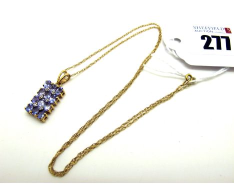 A Modern 9ct Rose Gold Tanzanite Panel Pendant, claw set throughout, on a fine chain (2.6grams). [2035469]