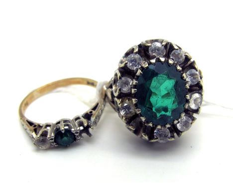 A Large Cluster Dress Ring, claw set, stamped  (stone missing) (finger size K); a three stone dress ring (stone missing) stam
