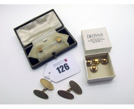 A Pair of 9ct Gold Cufflinks, the engine turned oval panels on chain connections (5grams); together with a pair of Art Deco R