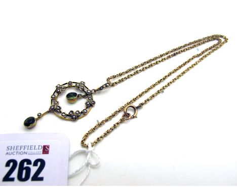 An Edwardian Openwork Pendant, of circular design, highlighted with seed pearls, with two collet set drops, on a fancy link c