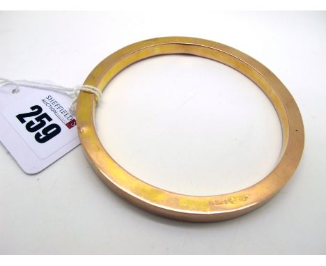 A 9ct Gold Hollow Bangle, Chester 1920 (17grams) (dents).  