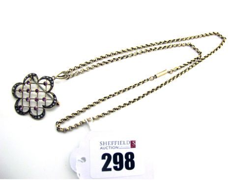 An Edwardian Openwork Pendant / Brooch, of shaped lattice design with seed pearl highlights (losses), stamped "9ct", on a bel
