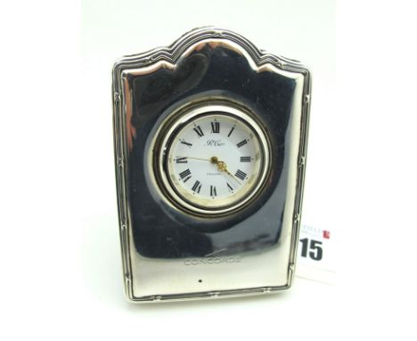 A Modern Hallmarked Silver Mounted 'Concorde' Bedside Clock, the R Carr signed dial with black Roman numerals, with ribbon an