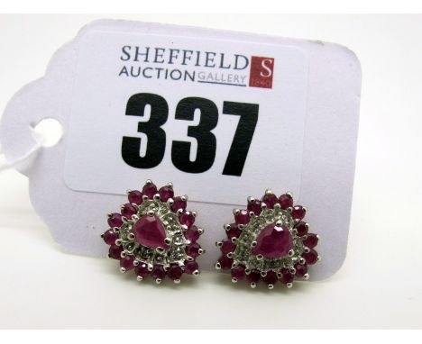 A Pair of Modern 9ct Gold Ruby and Diamond Set Heart Shape Cluster Earrings, claw and illusion set (2.6grams). [802602]