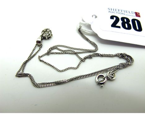 A Modern 9ct White Gold Diamond Cluster Pendant, stamped ".18", on a fine 9ct white gold chain (1.9grams). [2035443]