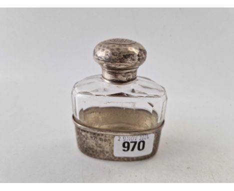 Oval flask with cut base screw cover and glass body.  London 1927