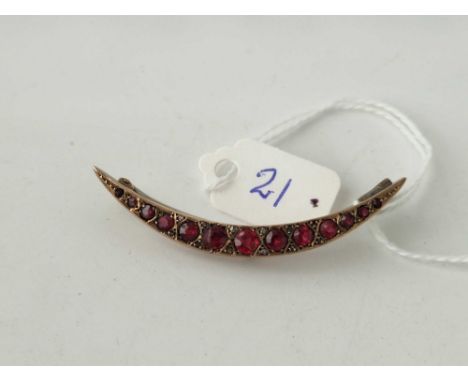 A Edwardian crescent brooch with ruby and diamonds 9ct 3.1 gms