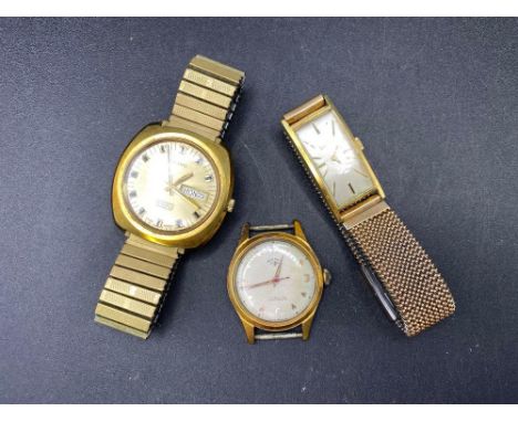 A gents VOLVO wrist watch with seconds sweep and date aperture and two others