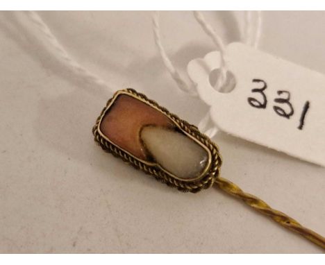 A unusual yellow metal stick pin in the form of a childs tooth memorial ????