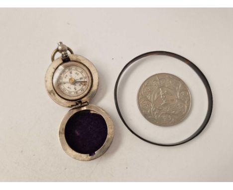 Bag containing a coin, fob compass and a tortoiseshell bangle