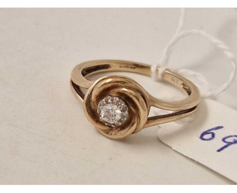 A diamond cluster ring with small diamonds around a larger central stone 9ct size Q 3 gms