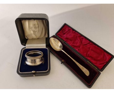 A boxed napkin ring with beaded edges and a boxed Christening spoon, Glasgow