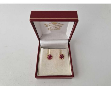 A pair of ruby earrings 9ct boxed