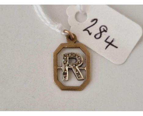 A initial R pendant with diamond 9ct 1.2 gms