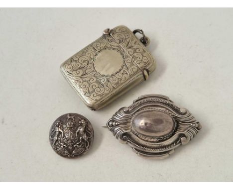 A silver brooch button and plated vesta case
