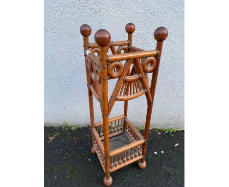 An Arts and Crafts stick stand with copper base