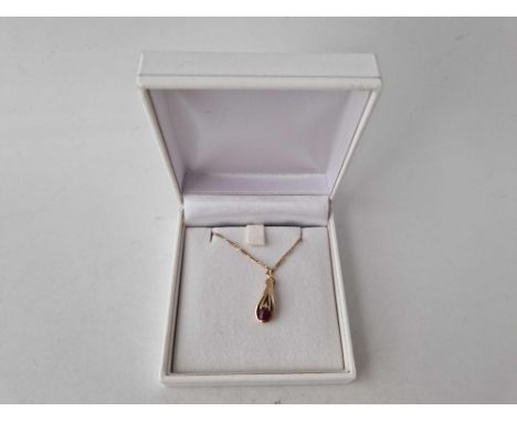 A diamond and ruby pendant necklace 9ct 16 inch boxed