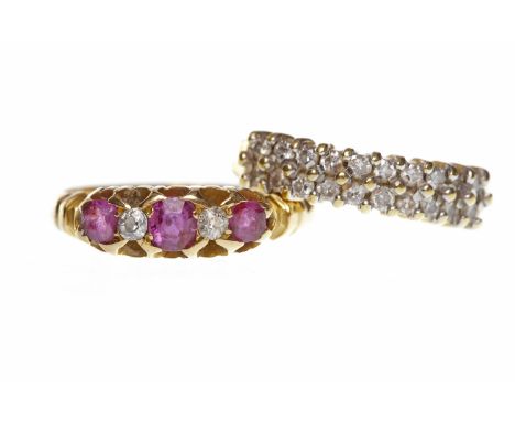 VICTORIAN EIGHTEEN CARAT GOLD CREATED RUBY AND DIAMOND RINGset with a central round created ruby flanked by two smaller creat