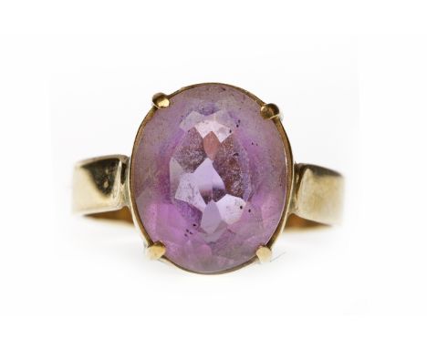 NINE CARAT GOLD AMETHYST DRESS RINGset with a single oval amethyst 12.6mm long, size N-O, 3.3g